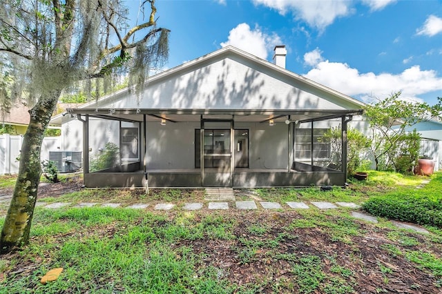 back of house featuring a sunroom