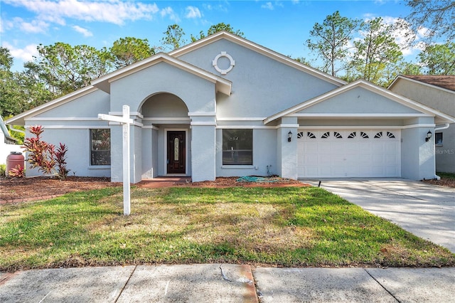 view of front facade with a garage and a front yard