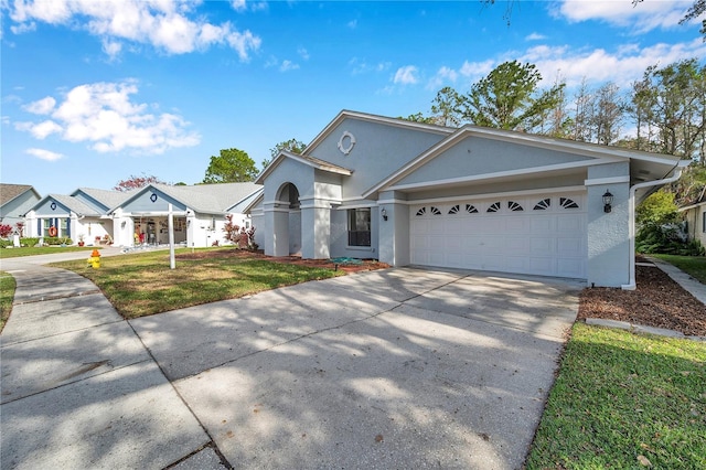 view of front of house with a garage and a front yard