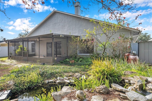 back of house with a sunroom