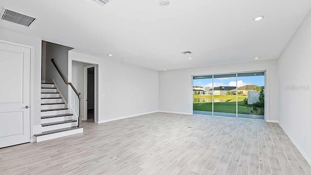 unfurnished room featuring light hardwood / wood-style flooring