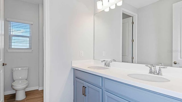 bathroom with vanity and toilet