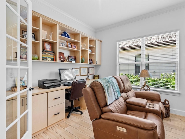 home office featuring ornamental molding, wood finish floors, and built in study area