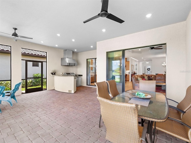 dining area with a ceiling fan and recessed lighting