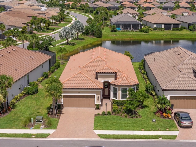 bird's eye view with a water view and a residential view