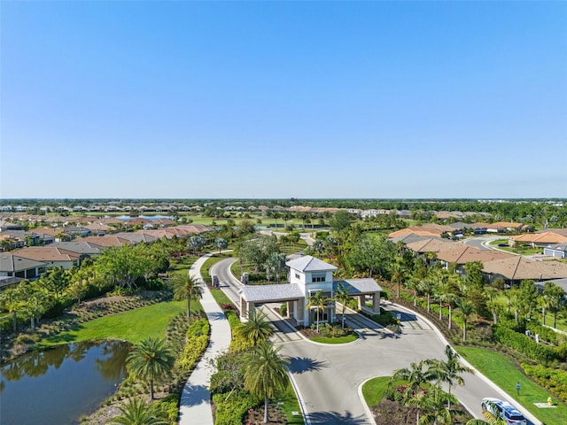 drone / aerial view featuring a water view and a residential view