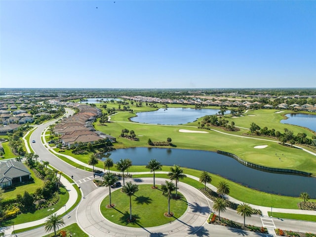 bird's eye view with a water view and golf course view