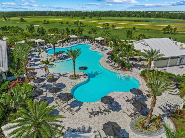 community pool with a patio area