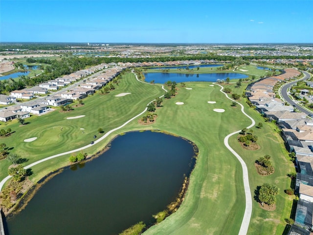 drone / aerial view with a water view, a residential view, and golf course view