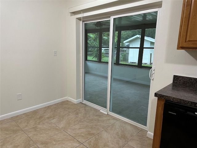 entryway with light tile patterned flooring