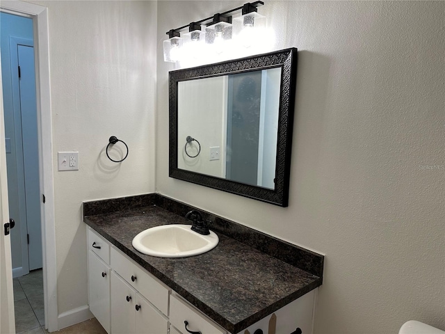 bathroom with vanity and tile patterned flooring