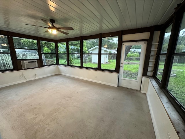 unfurnished sunroom with ceiling fan and wood ceiling