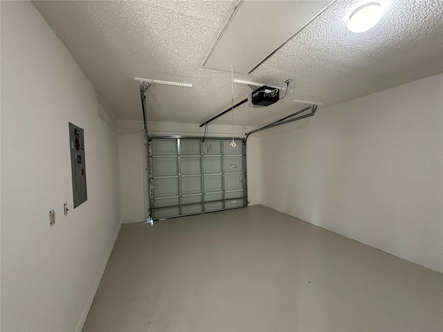 garage with electric panel and a garage door opener