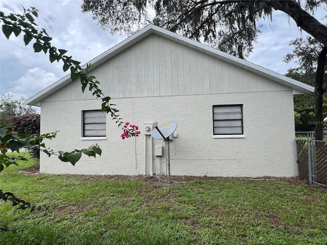 view of property exterior featuring a lawn