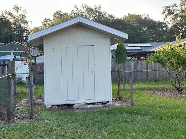 view of outdoor structure with a lawn