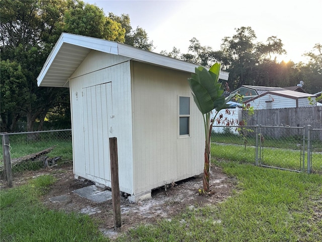 view of outbuilding with a yard