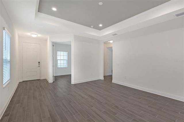 spare room featuring a tray ceiling