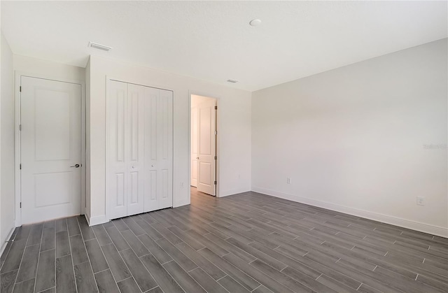 unfurnished bedroom with a closet