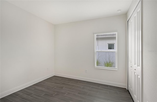 empty room featuring dark hardwood / wood-style floors