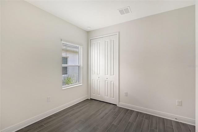 unfurnished bedroom with a closet