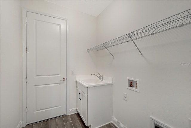 laundry area with sink and hookup for a washing machine