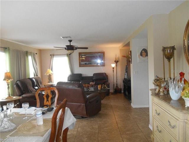 living room with tile floors and ceiling fan