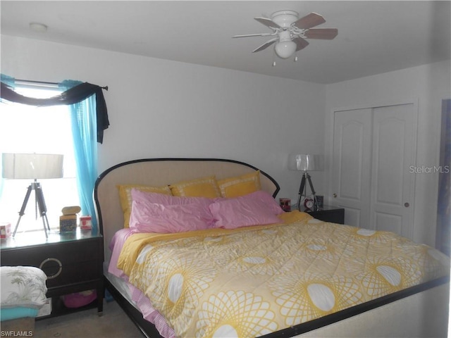 bedroom featuring a closet, carpet, and ceiling fan