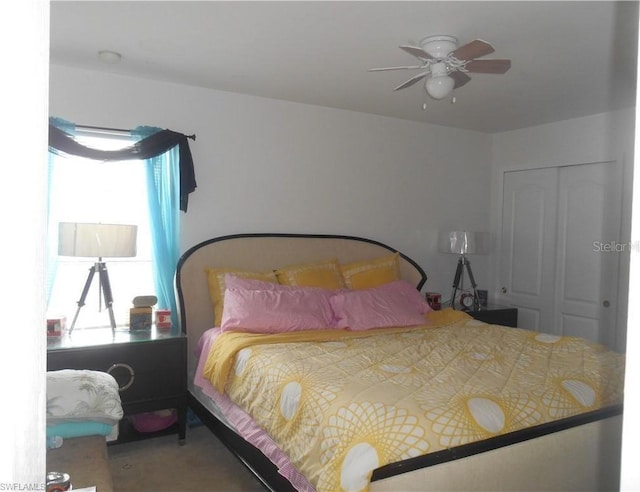 bedroom featuring carpet, a closet, and ceiling fan