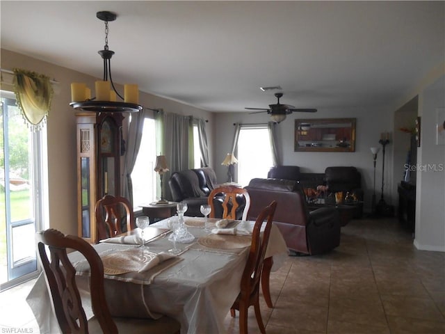 tiled dining room with ceiling fan