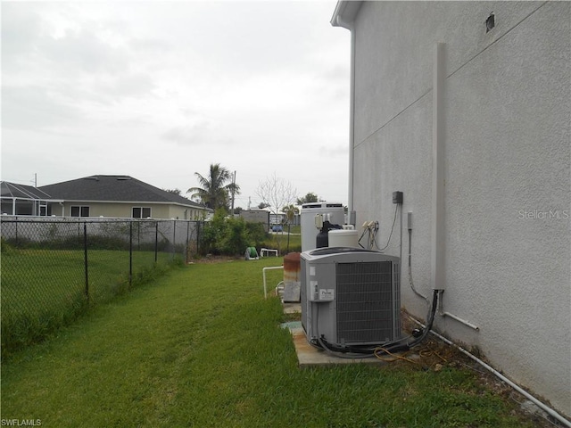 view of yard featuring central air condition unit