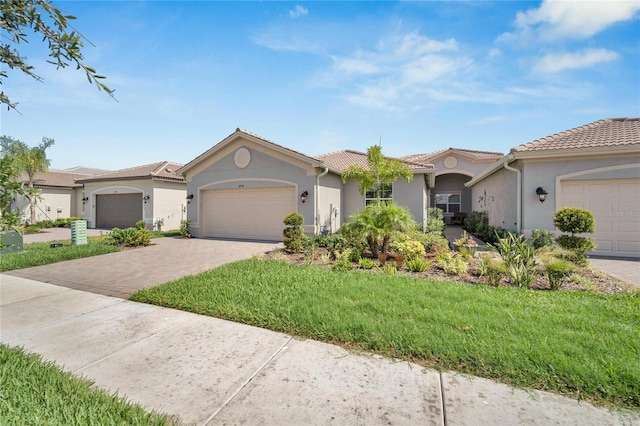 view of front facade with a front yard and a garage