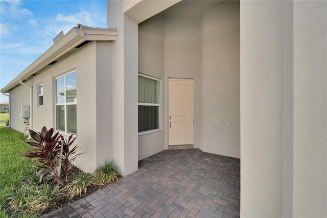 property entrance with a patio