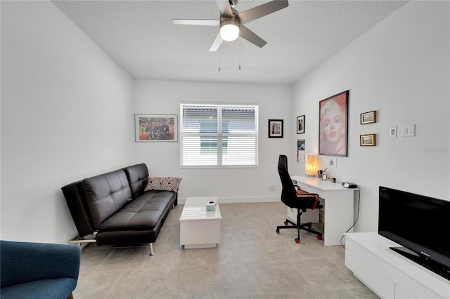 office space featuring ceiling fan, light tile patterned floors, and a textured ceiling