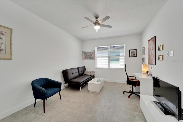 office area with ceiling fan, light tile patterned floors, and a textured ceiling