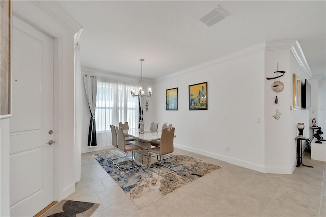 tiled dining space featuring a notable chandelier and ornamental molding