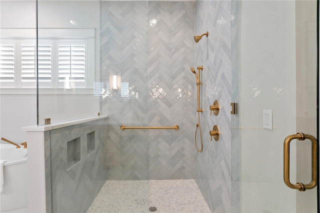 bathroom featuring an enclosed shower