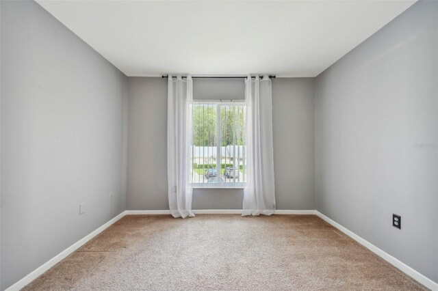 empty room featuring carpet floors