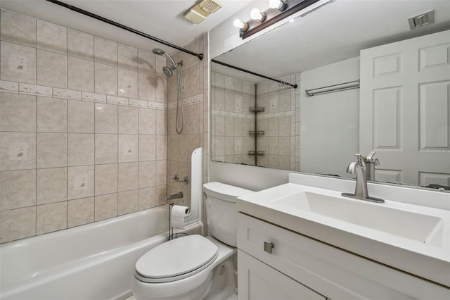 bathroom with visible vents, vanity, toilet, and tub / shower combination