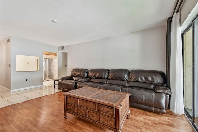 living room with light hardwood / wood-style flooring