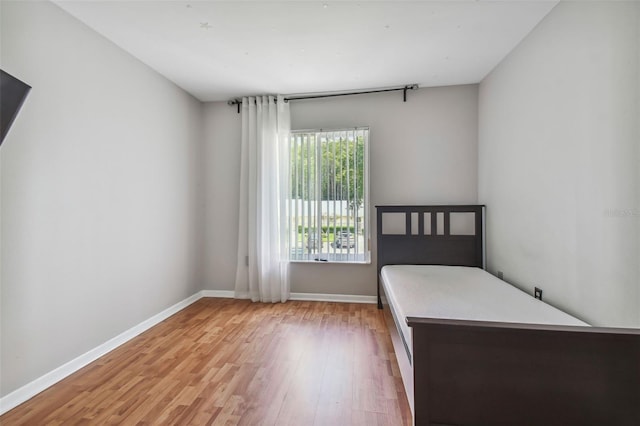 unfurnished bedroom with light wood-type flooring