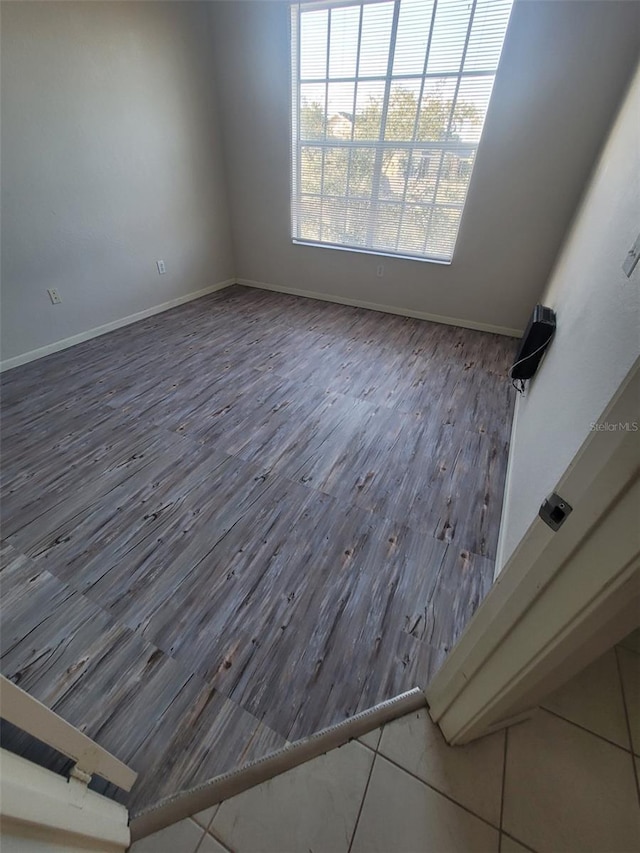 spare room featuring dark hardwood / wood-style flooring