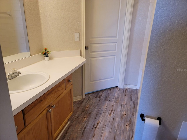 bathroom featuring vanity and hardwood / wood-style floors