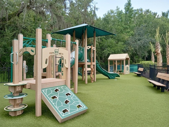 view of playground with a lawn