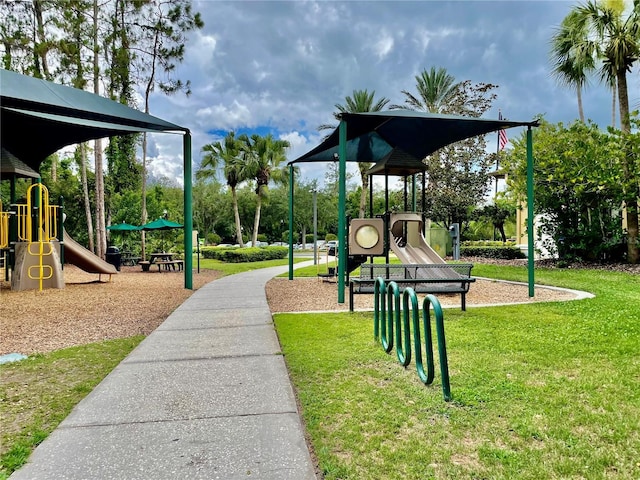 communal playground featuring a yard