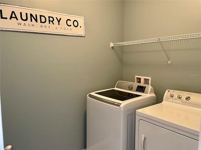 washroom with washer and clothes dryer