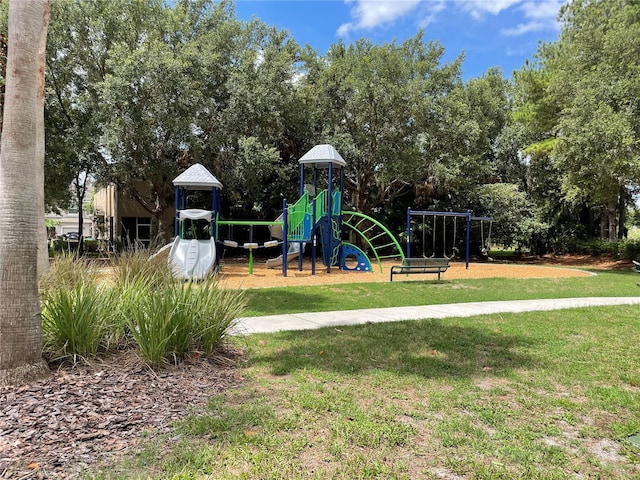 view of jungle gym with a lawn