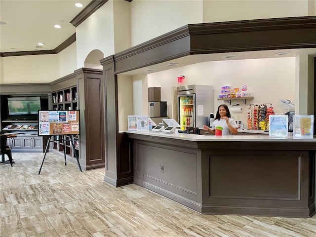 bar with recessed lighting and crown molding