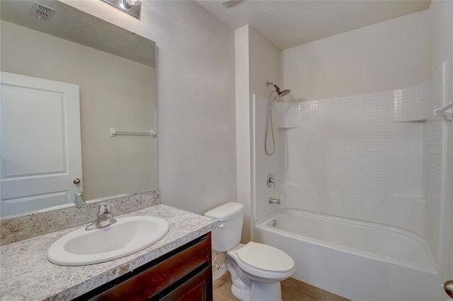 full bathroom with toilet, tile patterned flooring, vanity, and bathtub / shower combination