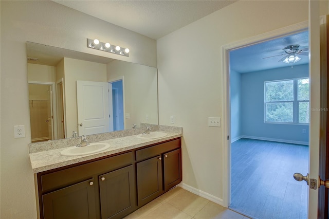 bathroom with ceiling fan and vanity