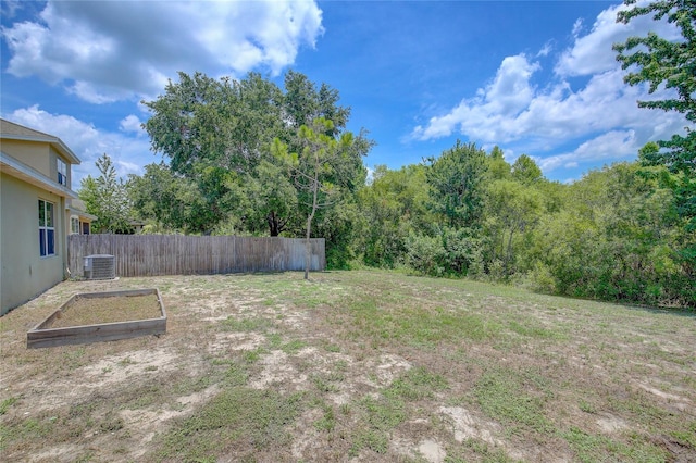 view of yard with central AC